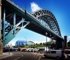 Low angle view of bridge against blue sky