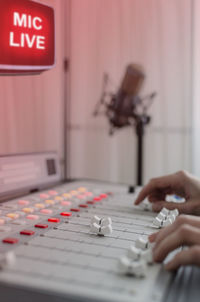 Close-up of hands in radio studio