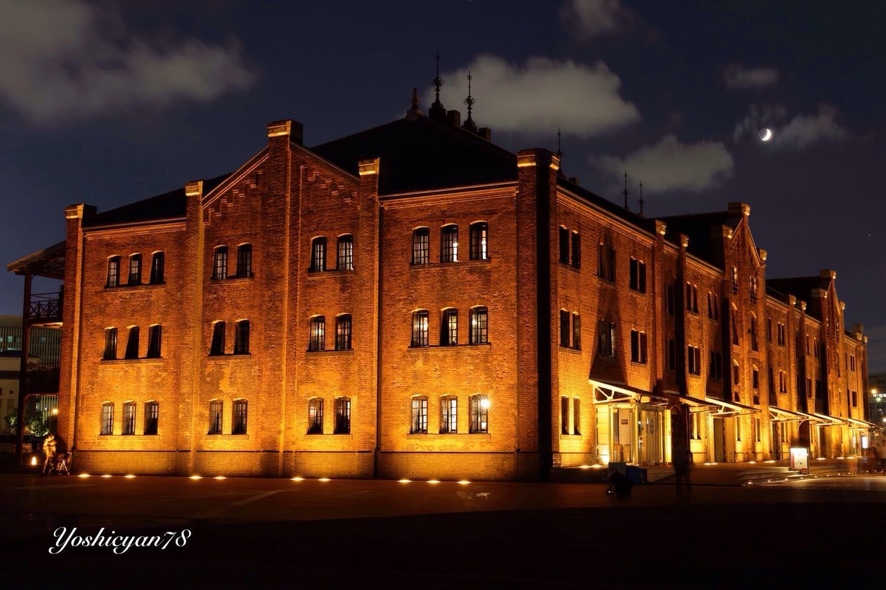 VIEW OF ILLUMINATED BUILDINGS AT NIGHT