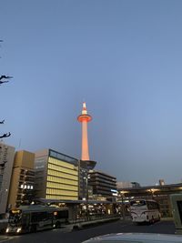 Street amidst buildings against clear sky