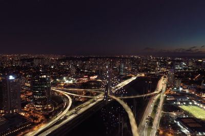 High angle view of illuminated buildings in city at night