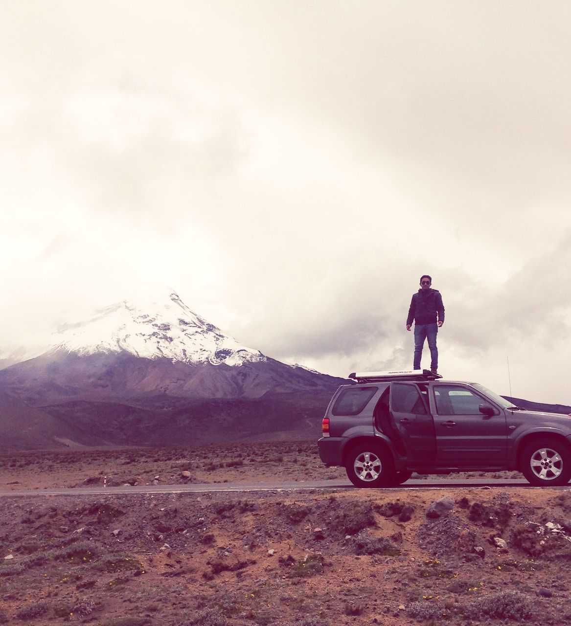 transportation, mountain, land vehicle, mode of transport, sky, cloud - sky, landscape, men, mountain range, travel, lifestyles, weather, nature, cloudy, full length, leisure activity, rear view, scenics