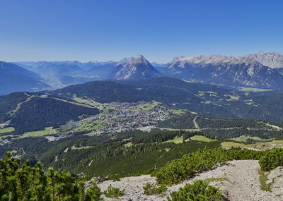 High angle view of mountains against clear blue sky