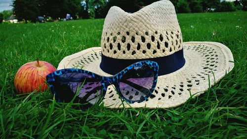 Close-up of hat on field