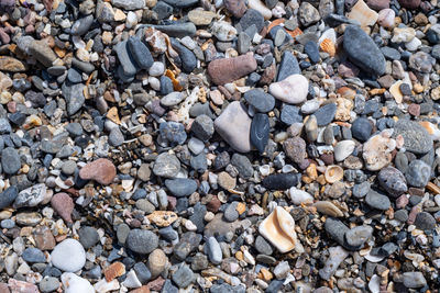 High angle view of stones on pebbles