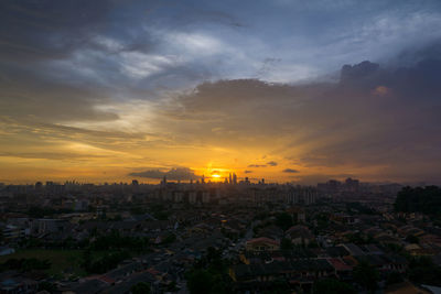 High angle view of city at sunset