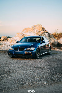 Side view of car on road against clear sky