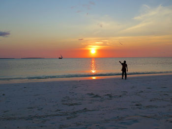 Silhouette of people on beach