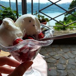 Close-up of hand holding ice cream