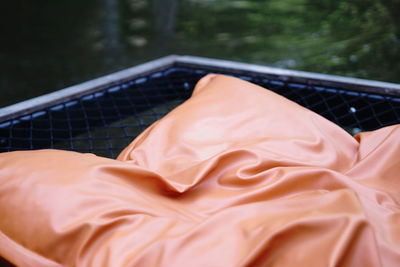 Close-up of hammock on bed