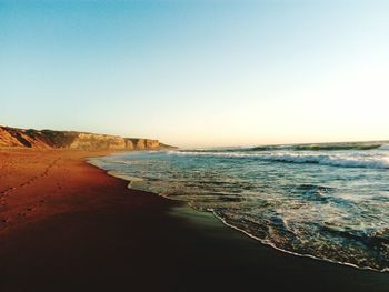 View of beach against clear sky