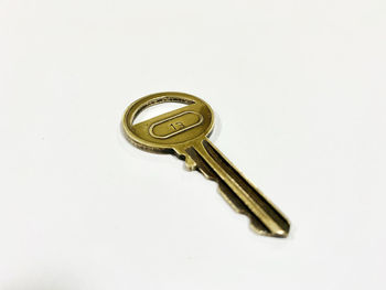 High angle view of key against white background