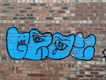 Graffiti on brick wall