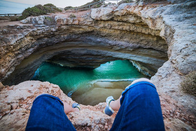 Low section of man standing in cave