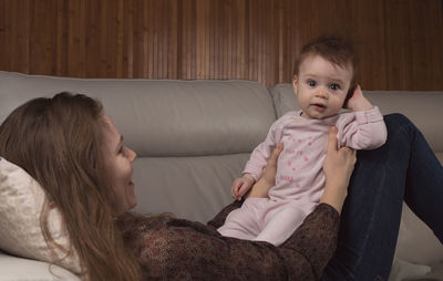 Portrait of cute baby girl at home