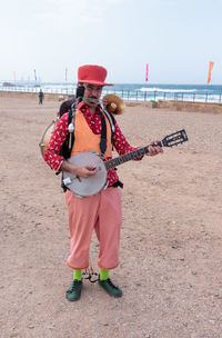 Full length of a man standing on beach