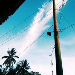 Low angle view of electricity pylon against sky