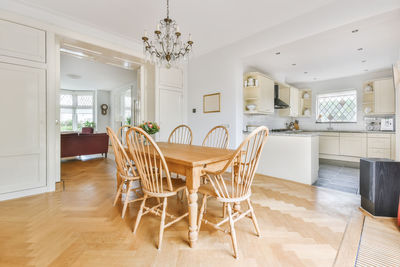 Empty chairs and tables in room