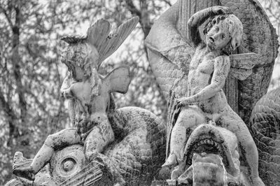 Close-up of angel statue in cemetery