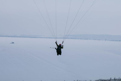 People paragliding against sky