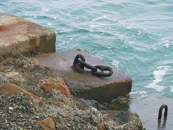High angle view of rusty metal on beach