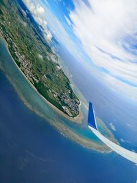 Aerial view of sea and landscape against sky