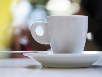 Close-up of coffee cup on table