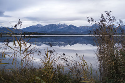 Scenic view of lake and mountains against sky