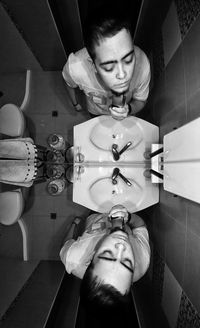 Portrait of mature man holding camera