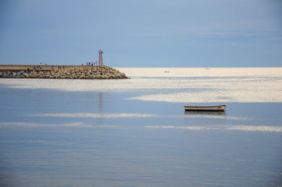 Boat in sea against clear sky