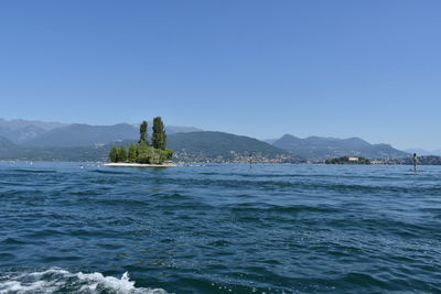 Scenic view of sea against clear blue sky