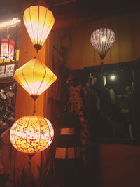 Illuminated lanterns hanging at home