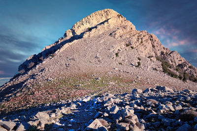 Rock formation on land against sky