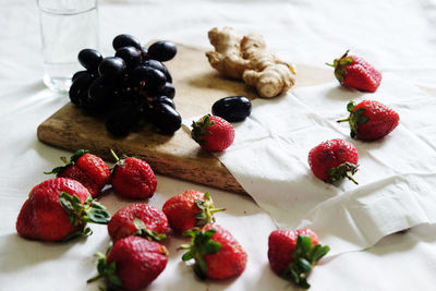 Close-up of strawberries on tablecloth