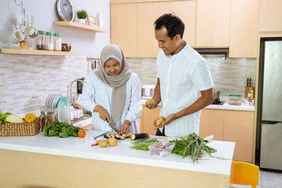 Man standing by food at home