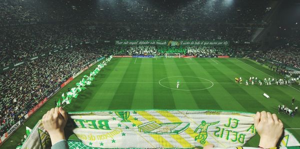 People playing soccer on field