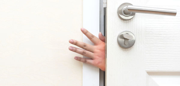 Close-up of hand on door