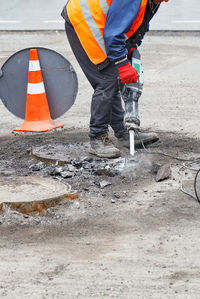 Low section of man working at construction site