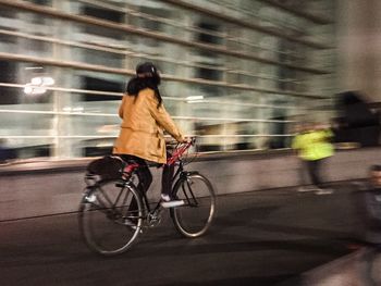 Man riding bicycle on road