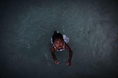 High angle view portrait of girl in water