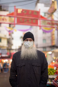 Portrait of man standing outdoors