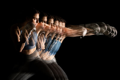 Boxer ilse lyan noor. motion study with stroboscopic light on black background