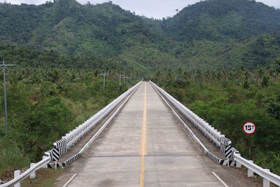 Road leading towards forest