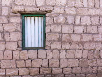 Full frame shot of window on wall of building