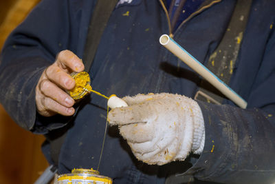 Cropped hand of man holding food