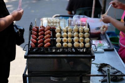 Food on barbecue grill at market