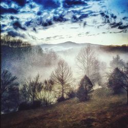 Scenic view of landscape against cloudy sky