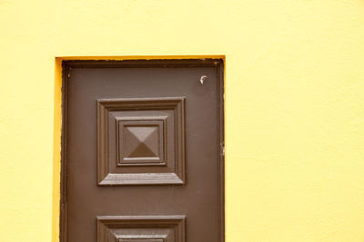 Yellow door of building