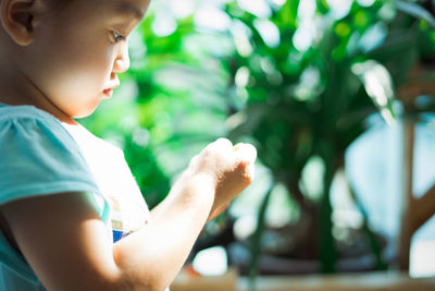 Close-up of boy looking at camera