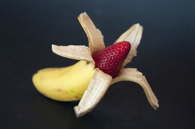 Close-up of fruits against black background